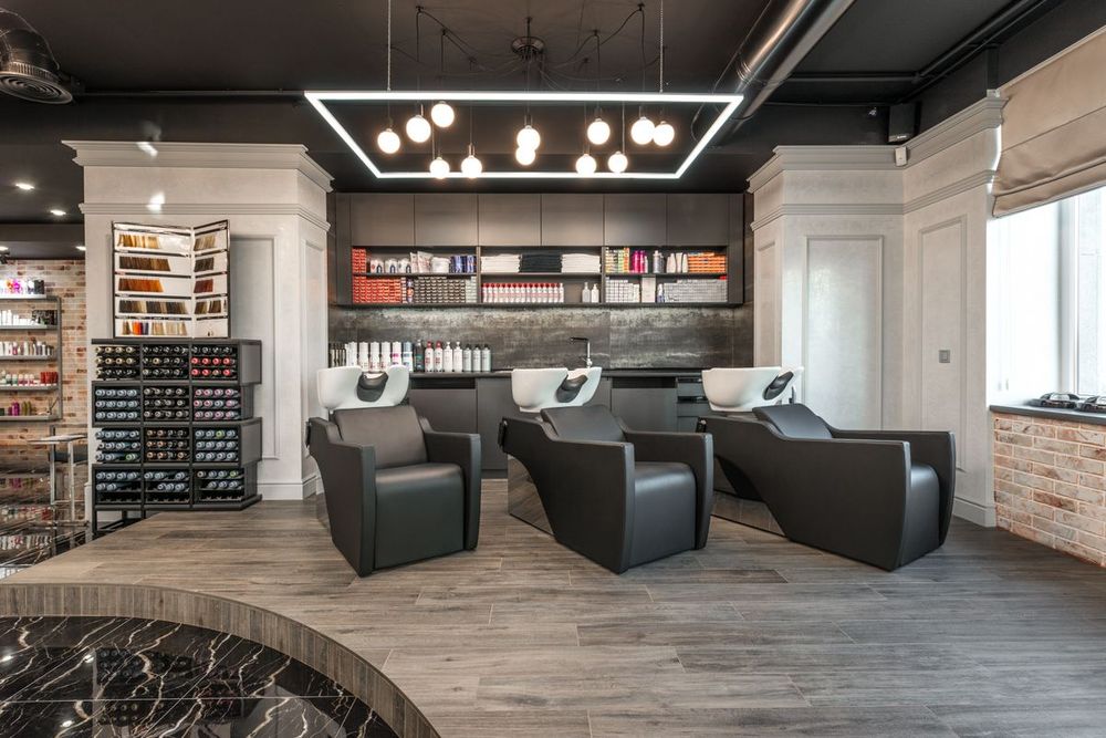 Stylish salon interior with modern chairs and product shelves